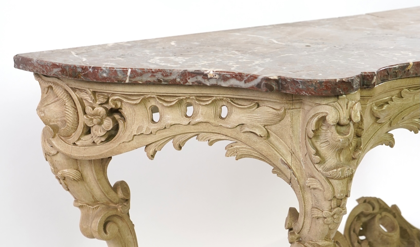 A 19th century Louis XV style marble topped painted serpentine console table